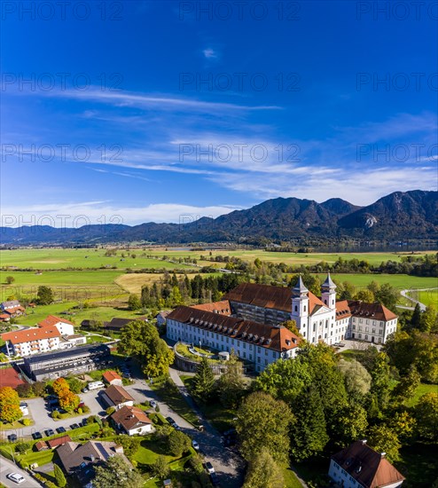 Aerial view of Schlehdorf Monastery with St. Tertulin Parish Church at Lake Lake Kochel