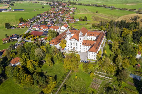 Aerial view of Schlehdorf Monastery with St. Tertulin Parish Church at Lake Lake Kochel