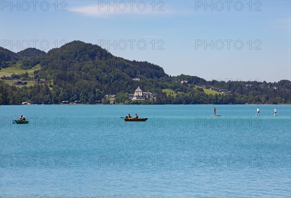 Boats at the Fuschlsee with castle Fuschl