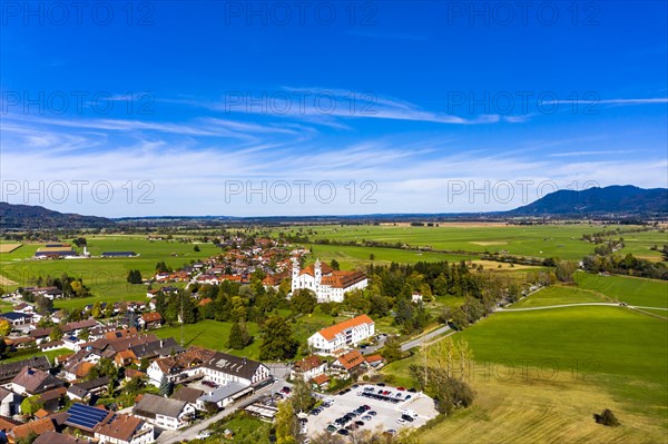 Aerial view of Schlehdorf Monastery with St. Tertulin Parish Church at Lake Lake Kochel