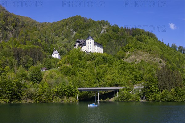 Castle Klaus with mountain church at the Klaus reservoir