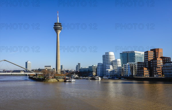 City panorama at the Media Harbour with Gehry buildings at the new Zollhof and Rhine Tower