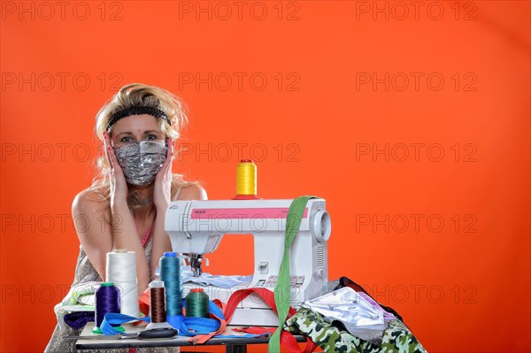 Young woman with sewing machine