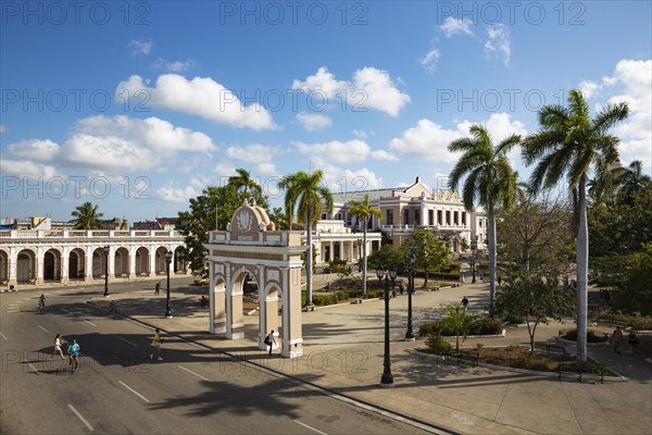 Porticoed Neoclassical buildings frame the Parque Jose Marti