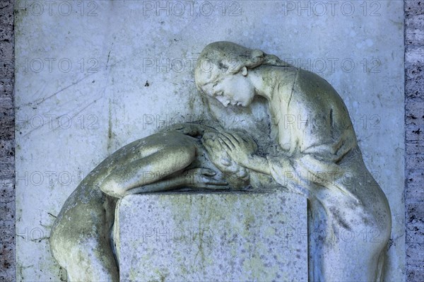 Gravestone with relief of two mourning female statues