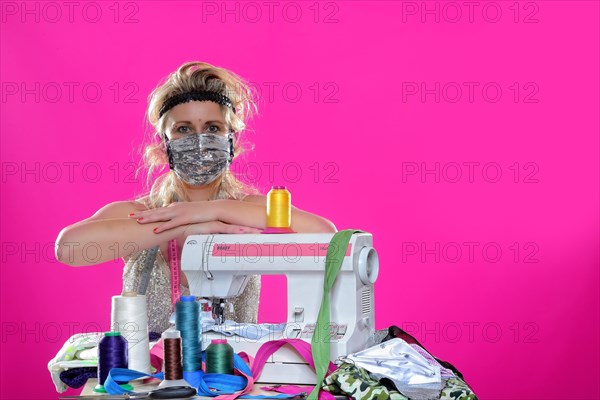 Young woman with sewing machine