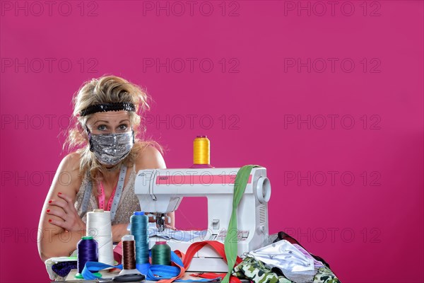 Young woman with sewing machine