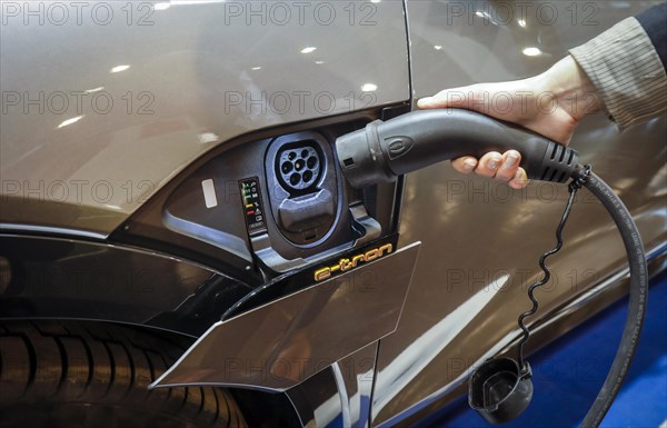 Audi e-tron electric SUV being charged
