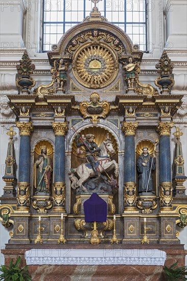 Side altar with figures of saints and the dragon slayer St. Michael