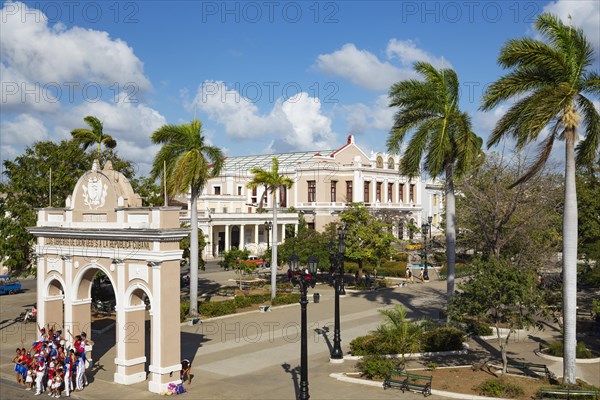 Porticoed Neoclassical buildings frame the Parque Jose Marti