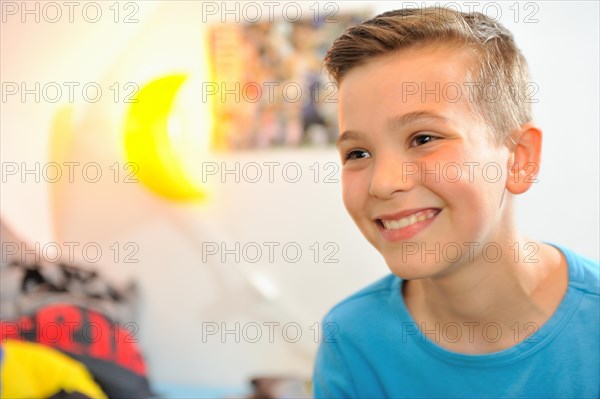 Boy at home playing computer games