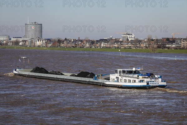 Freighters navigating on the Rhine during floods