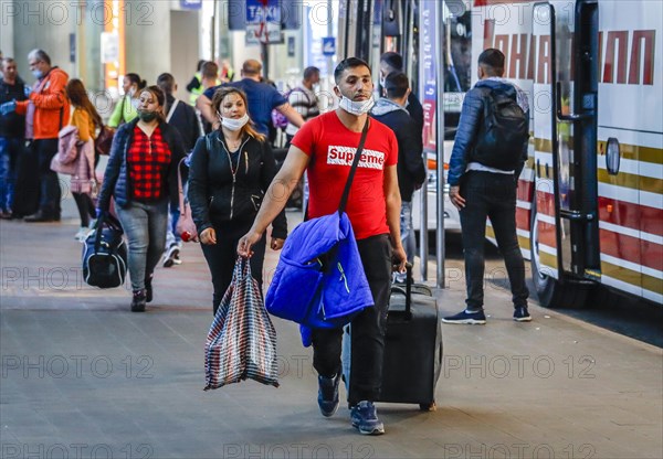 Romanian harvest workers land at Duesseldorf airport with special machines and travel by bus to the farms