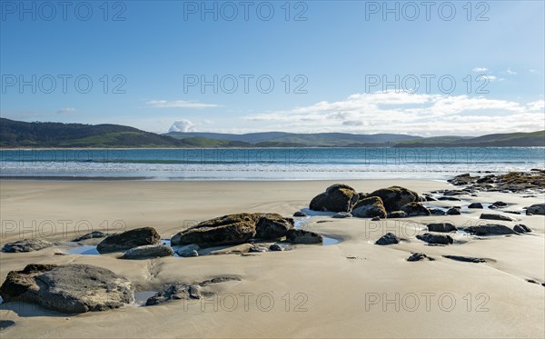 Stones on sandy beach