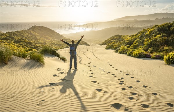 Young man stretching his arms in the air