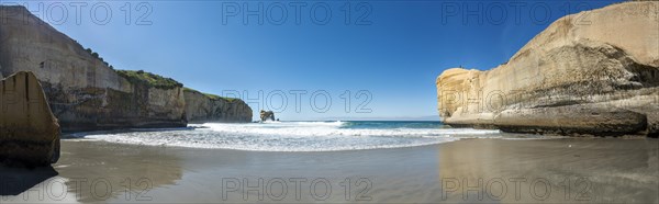 Sand beach with sandstone cliffs