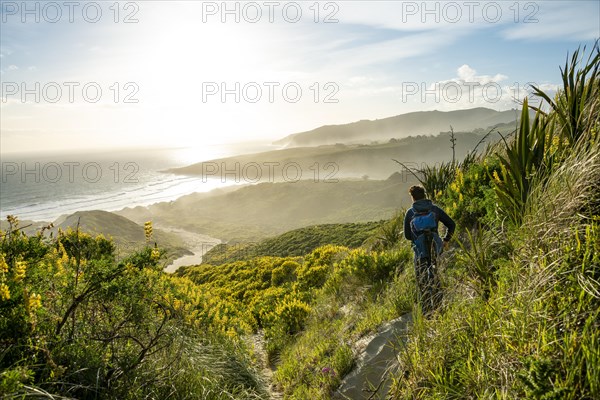 Young man looking over a bay