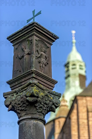 Wayside shrine in front of the neo-gothic collegiate church of St. John the Baptist