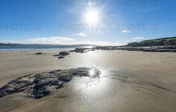 Stones on sandy beach