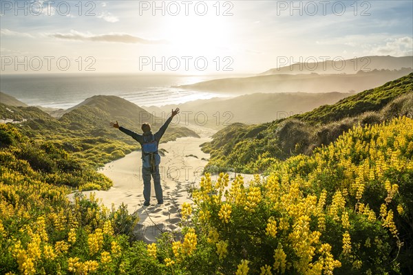 Young man stretching his arms in the air