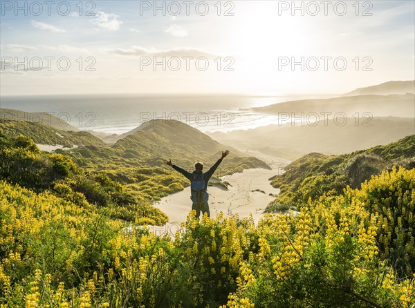 Young man stretching his arms in the air