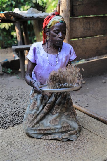 Woman prepares coffee