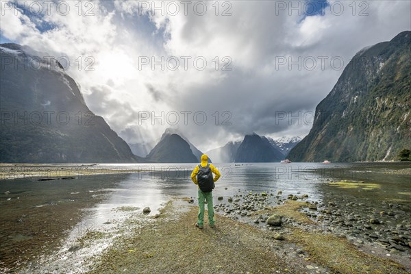 Young man looks out over the fjord