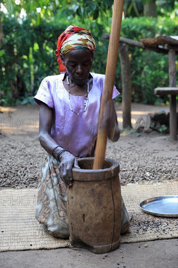 Woman prepares coffee