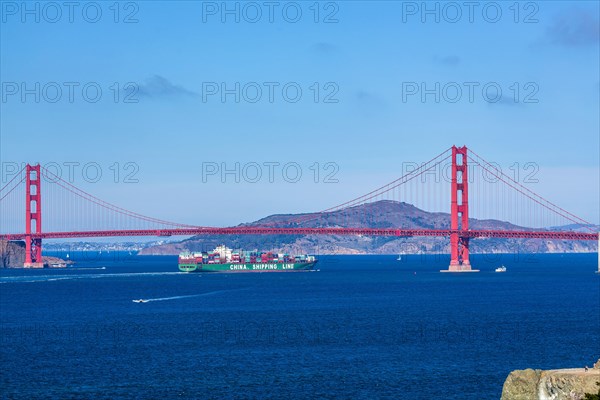 Container ship under Golden Gate Bridge