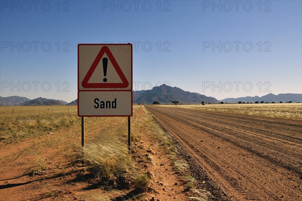 Road sign warns of sand