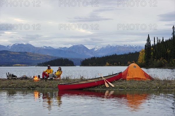 Couple around a campfire