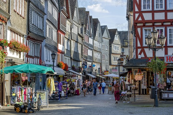 Shopping street with historic half-timbered houses