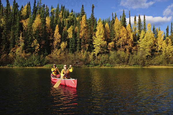 Couple canoeing in lake