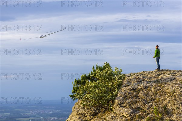 Man with model airplane on the Breitenstein