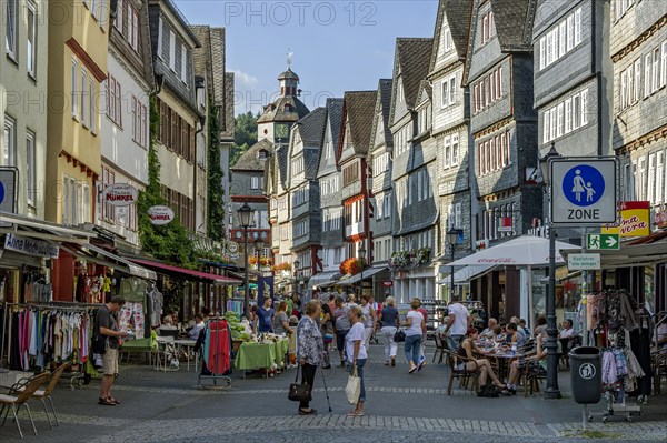 Shopping street with historic half-timbered houses