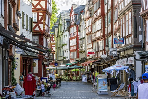 Shopping street with historic half-timbered houses