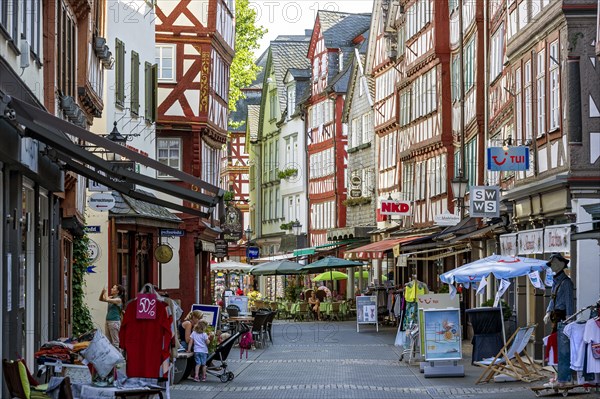 Shopping street with historic half-timbered houses