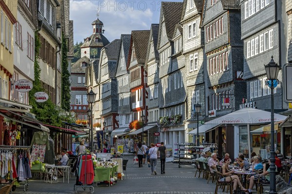Shopping street with historic half-timbered houses