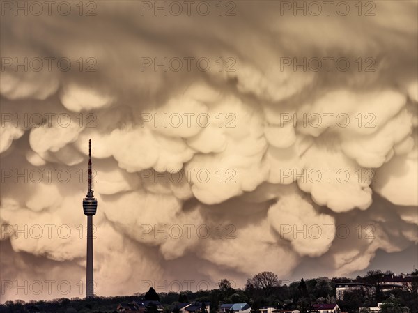 TV tower in front of dramatic mammatus clouds in the evening