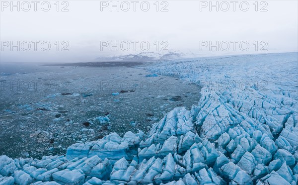 Panoramic view of glacier lagoon and glacier wall