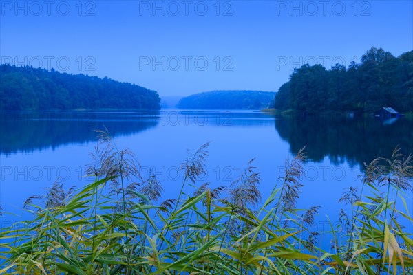 Blue hour at the lake Schmaler Luzin with boathouse