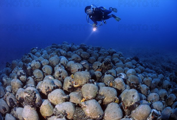 Divers and antique amphorae