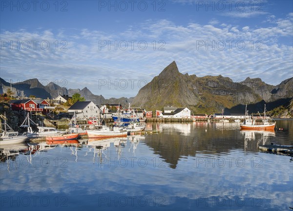 Wooden houses settlement and fishing boats