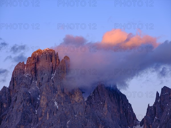 Wisps of clouds over the summit of the Sassolungo