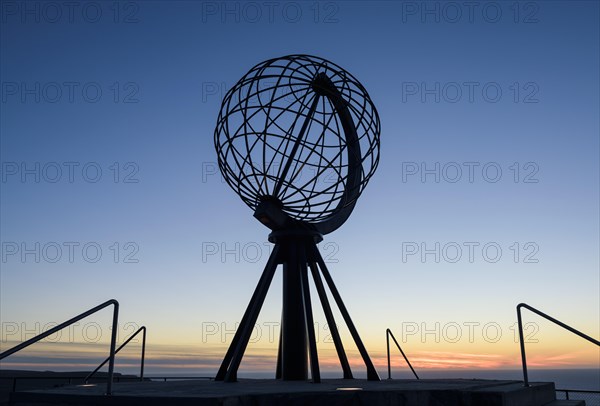 Steel globe on the North Cape after sunset