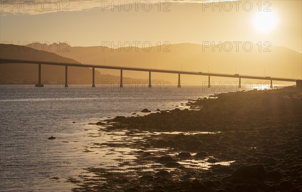 Bridge over the Gimsoy Straumen highway E6 at sunset