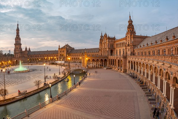 View over the illuminated Plaza de Espana at dusk Panorama