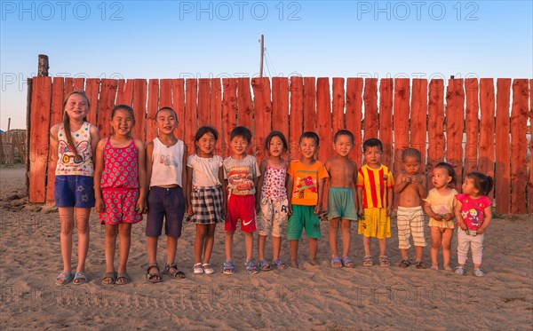 Children pose in a row