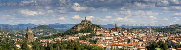 City view with statue of the Virgin Mary Notre Dame de France and cathedral