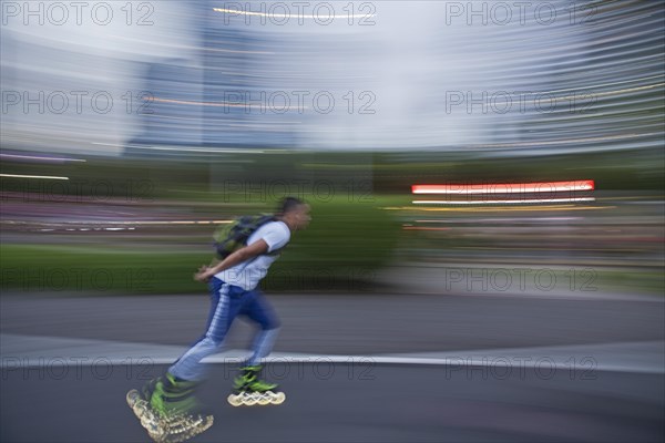 Inline skaters on the sidewalk next to Balboa Avenue